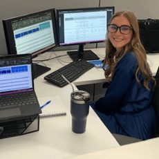 2024 Summer Intern Allison Clark Working at Desk