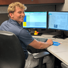 2024 Summer Intern Jack Bikus Working at Desk