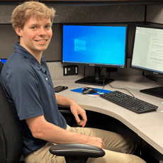 2024 Summer Intern Ryan Doell Working at Desk